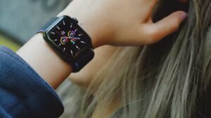 A man wearing an Apple Watch SE on his wrist