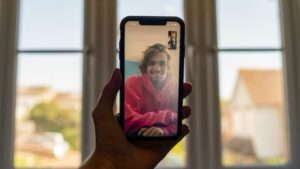 person using FaceTime on their iPhone