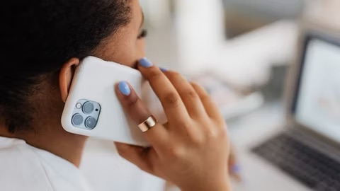 woman making a call on an iphone pro with white phone case  